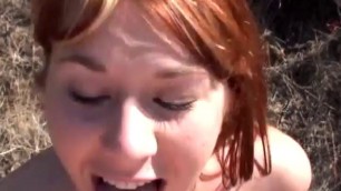 Cute redhead chokes on a dick outdoors 