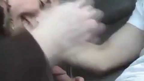Cute girl gives a blowjob in a car