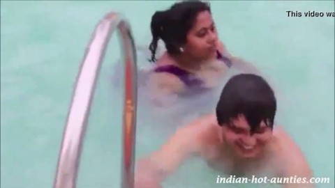 Hindi 47 yrs old married hot swim trainer aunty showing and jiggling her boobs during training session to 26 yrs old guy at the 