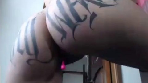 fake-breasted tattooed latin cam-slut