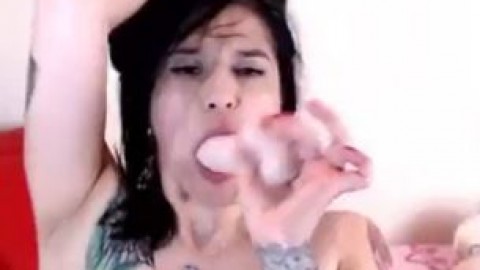 Tattooed Latina camgirl with big tits fucks her dildo