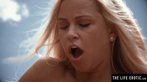 Sexy blonde gets naked outdoors and masturbates to a wild orgasm