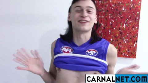 Cute Australian guy licks his own massive ten-inch cock!