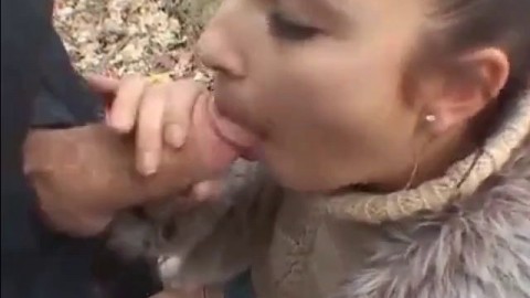 Girl in fur coat give blowjob in forest