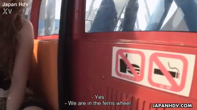 Asian bitch sucking a dick on a ferris wheel