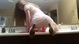 Amateur striptease Dancing in the bathroom and sucks dildo on webcam