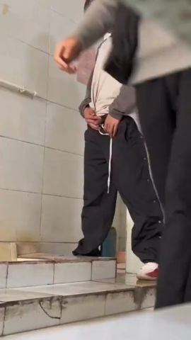 Males are pissing in the toilet 19.