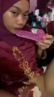 Hijab girl playing with dildo
