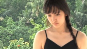 A young Japanese woman in a bathing suit near the sea beautiful body striptease Airi Suzuki Cute