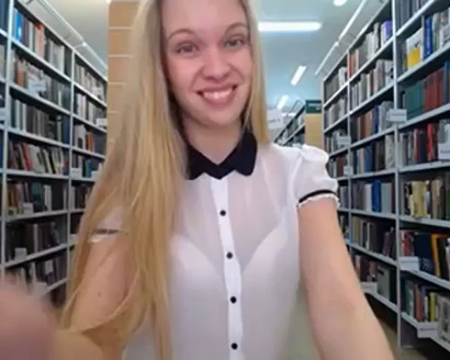 Teen blond girl in the library in a short skirt amateur