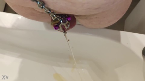 Submissive pissing thru catheter being locked in small chastity cage