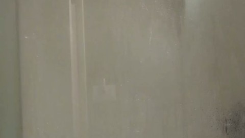 Fucking a big John Holmes dildo in the shower