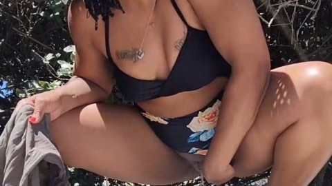 Ebony milf Trying not to get caught peeing behind humans