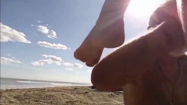 Blonde slut sucks old guys dick on the beach in Florida