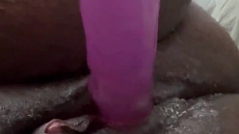 Getting horny with the purple dildo