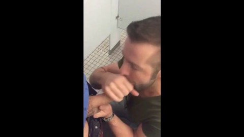 Hunk gives blowjob in a public restroom - amateur gay porn