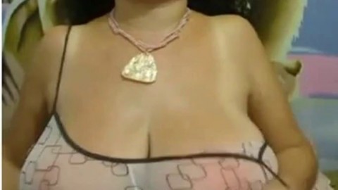 Big-Breasted Black Mature Woman Shows Off on Webcam