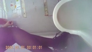Chinese girl peeing in the toilet