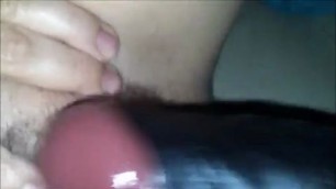 Woman puts himself in black dildos hairy pussy