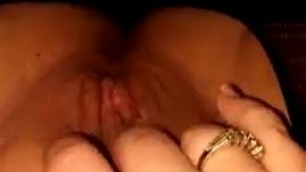 woman fondles plump hairy pussy