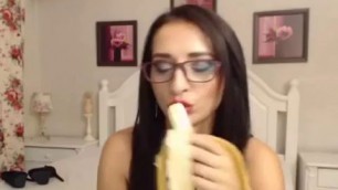 Brunette Girl Eating A Banana While On Cam