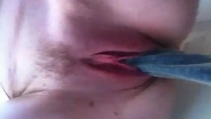 woman with hairy pussy masturbates