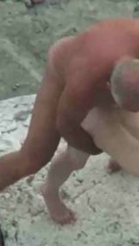 Old man fucks young girl hard on a rocky beach