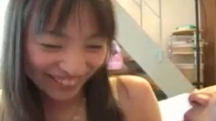Asian teen with a pretty smile has fun with her
